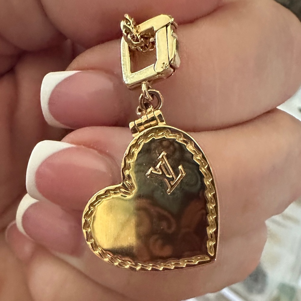 SOLD…. Louis Vuitton 18kt yellow gold locket pendant